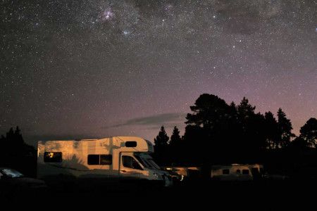 A campervan parked under the stars in Dunedin.